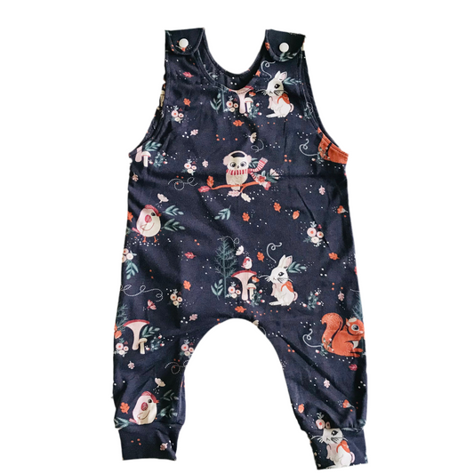 Navy blue romper with animal print on a white background