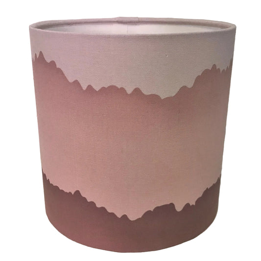 Cylindrical lampshade with a gradient design on a white background