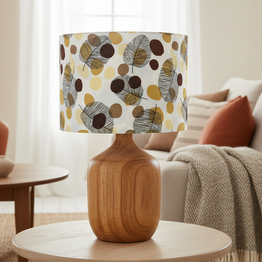 Decorative lamp with a patterned shade on a table in a living room.