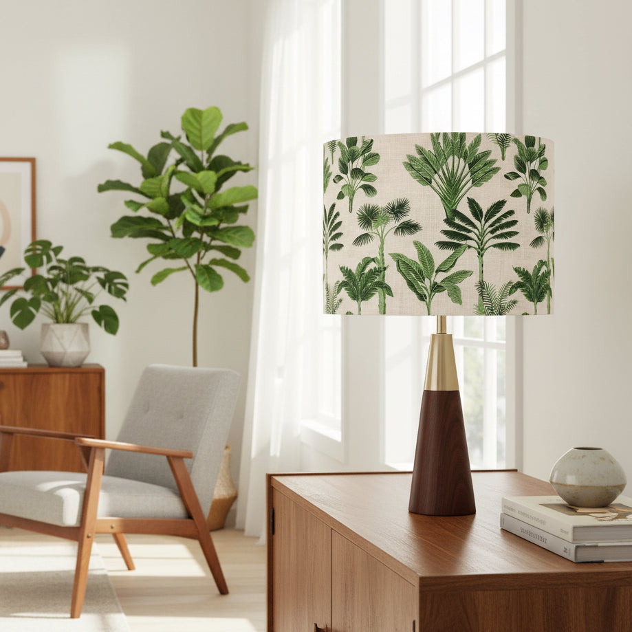 Living room with a lamp featuring a green leaf pattern on a wooden table.