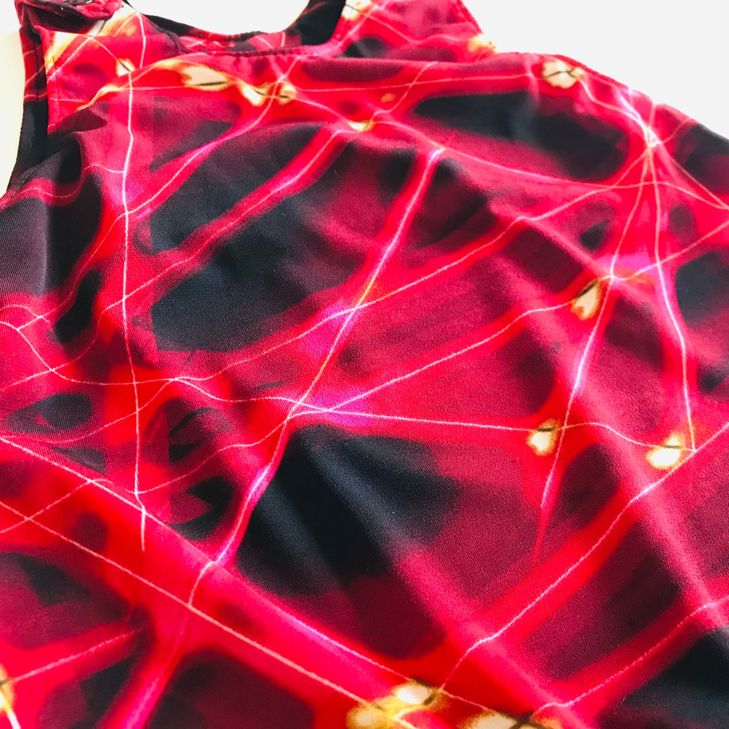 Close-up of a red and black fabric with abstract pattern