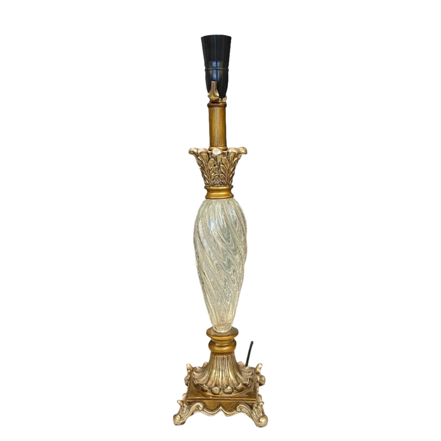 Decorative lamp on a desk with shelves and a door in the background