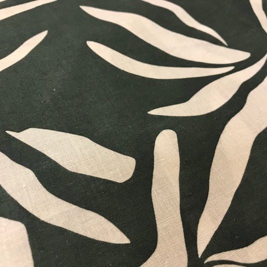 Pattern of beige leaves on a black background