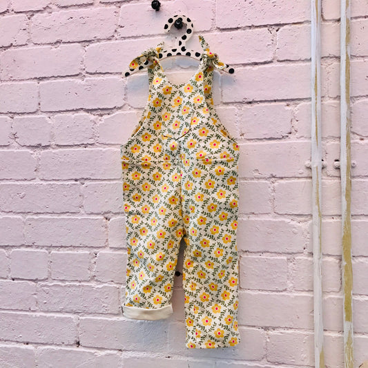 kids overalls with tie shoulders and yellow flower print, made of pinwale cord