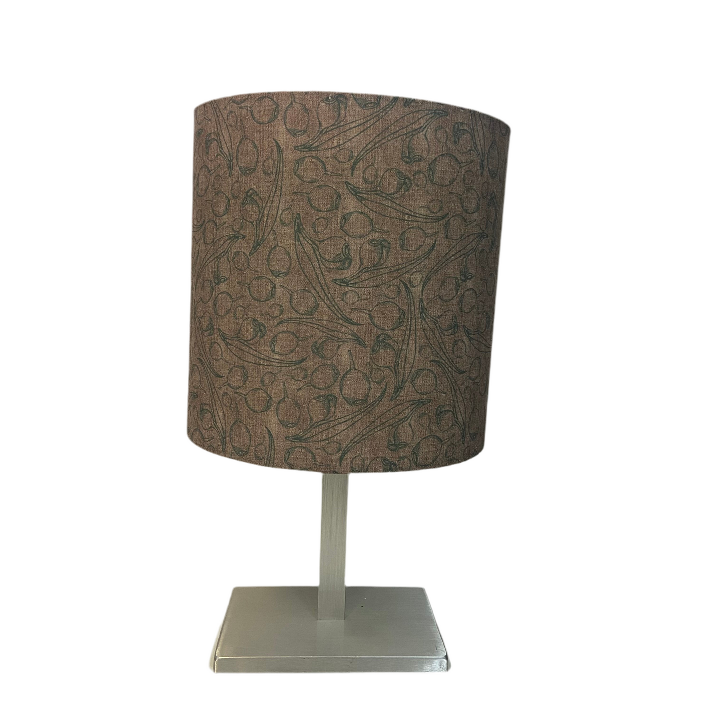 Table lamp with a patterned brown shade on a white background