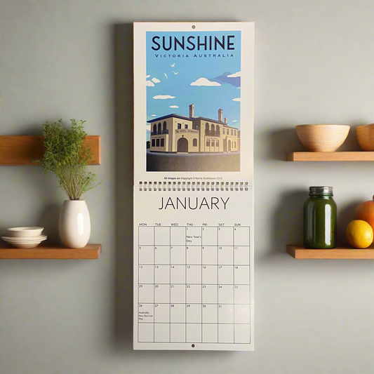 Calendar with a scenic illustration of a building on a wall above a shelf with decorative items.