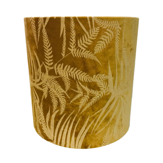 Mustard Gold cylindrical lampshade with leaf pattern on a white background