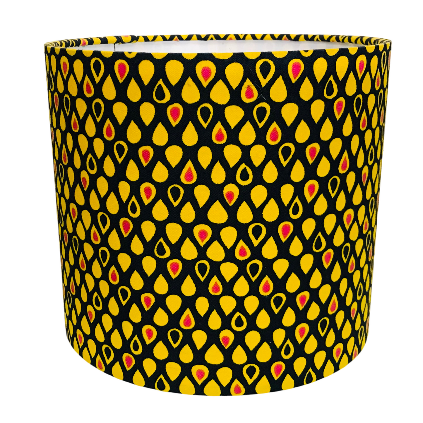 Cylindrical lampshade with a yellow and red pattern on a black background