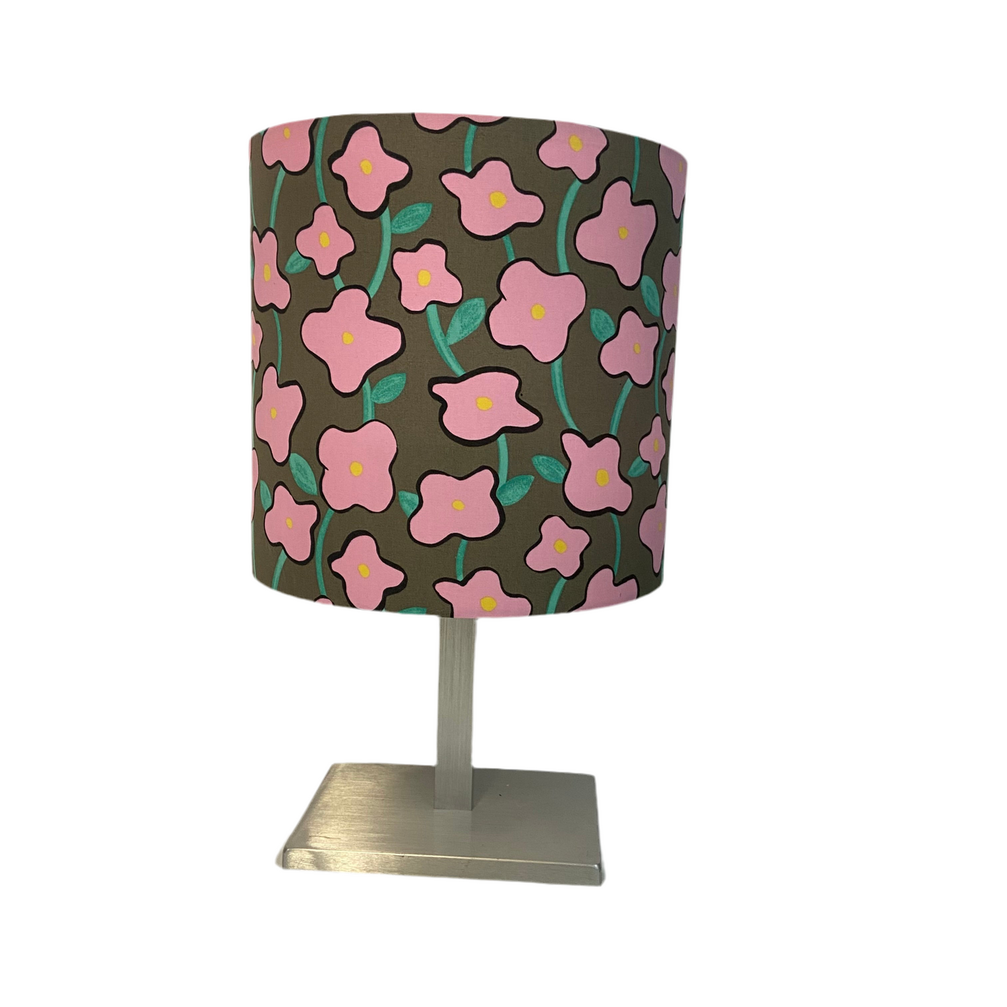 Table lamp with a floral patterned shade on a white background