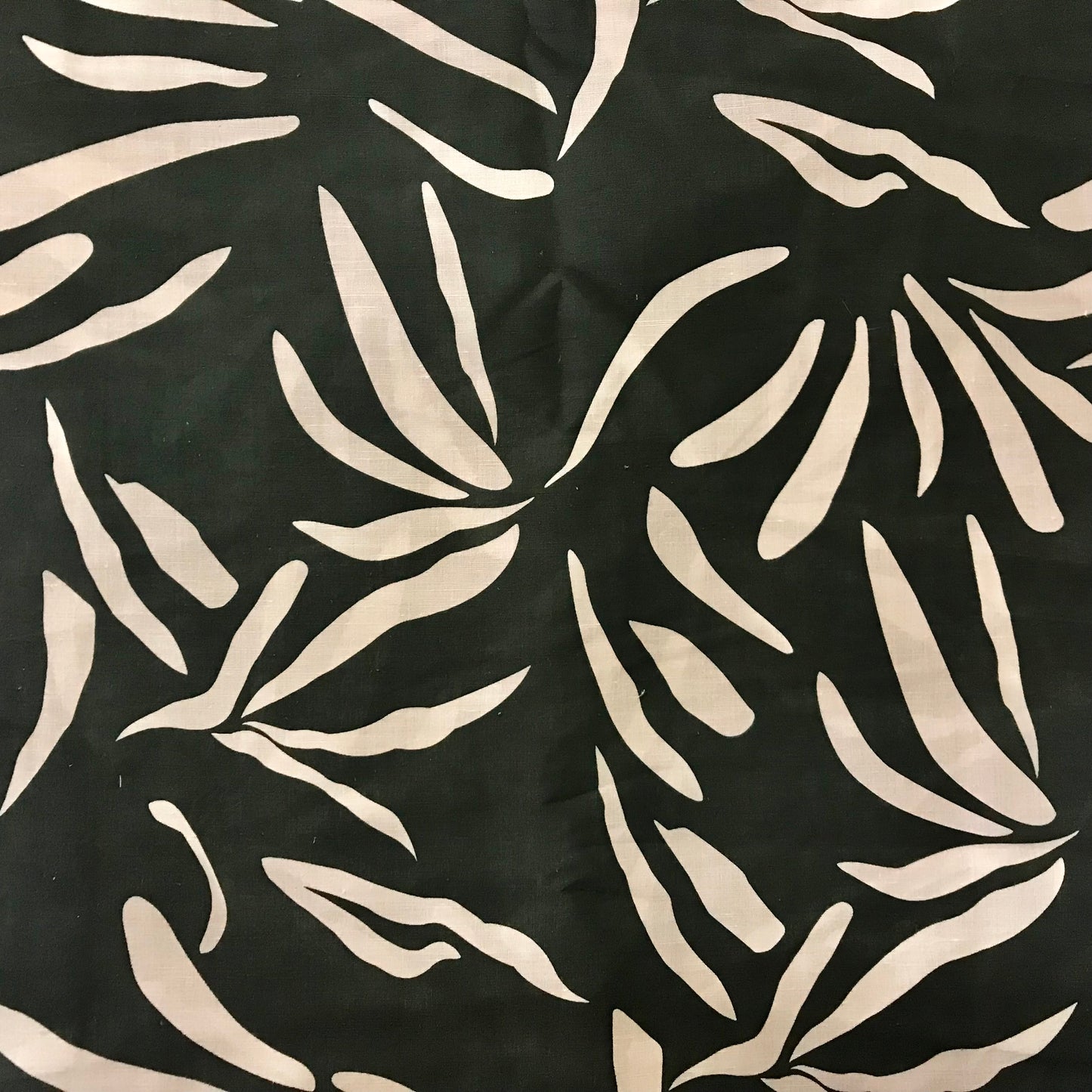Pattern of white leaves on a black background
