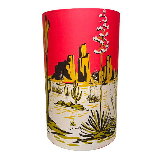 Cylindrical lampshade with desert landscape design on a white background