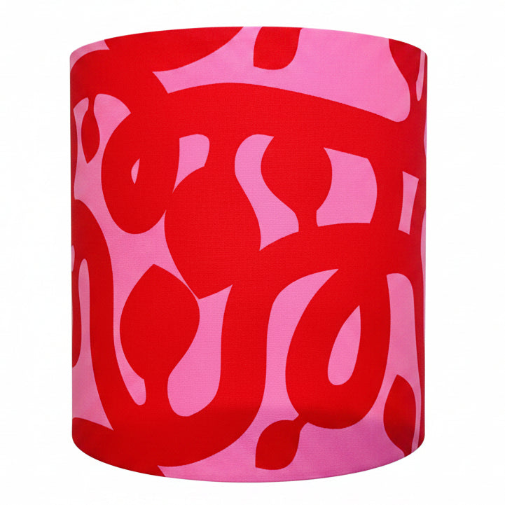 Red and pink patterned lampshade on a white background