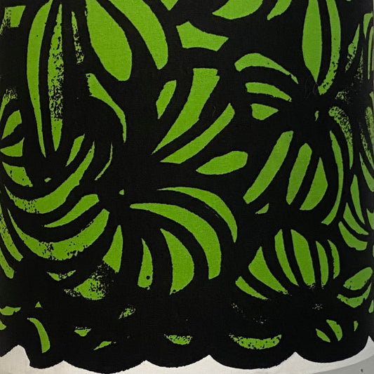 patterened marimekko textile with lime and black markings with white trim at base
