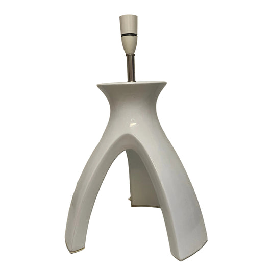 White ceramic lamp base on a plain background