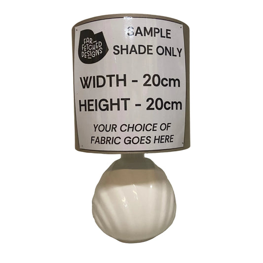 White lampshade with text on a plain background