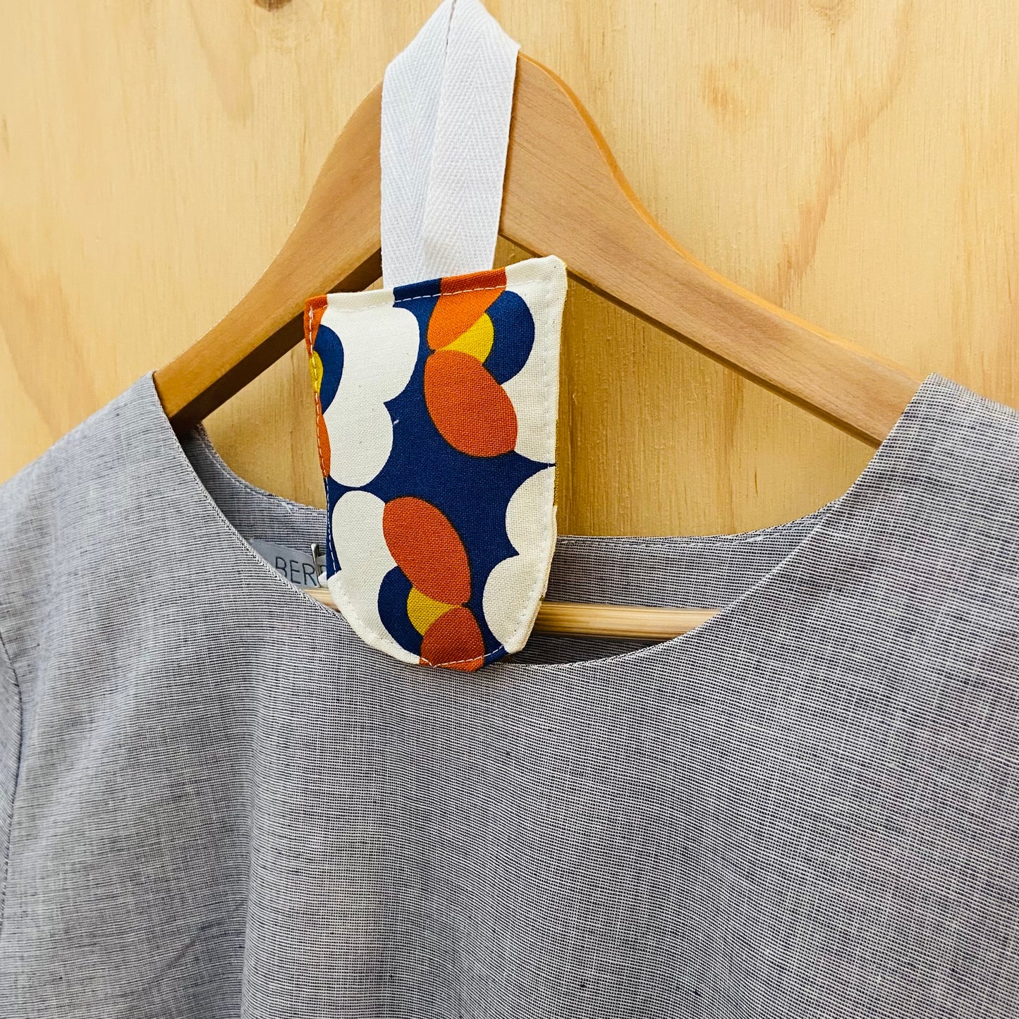 small hanging pouch filled with lavender to hang in your wardrobe or place in your clothing drawers to leave the space gmelling fresh. This set of four pouches have a retro floral textile.