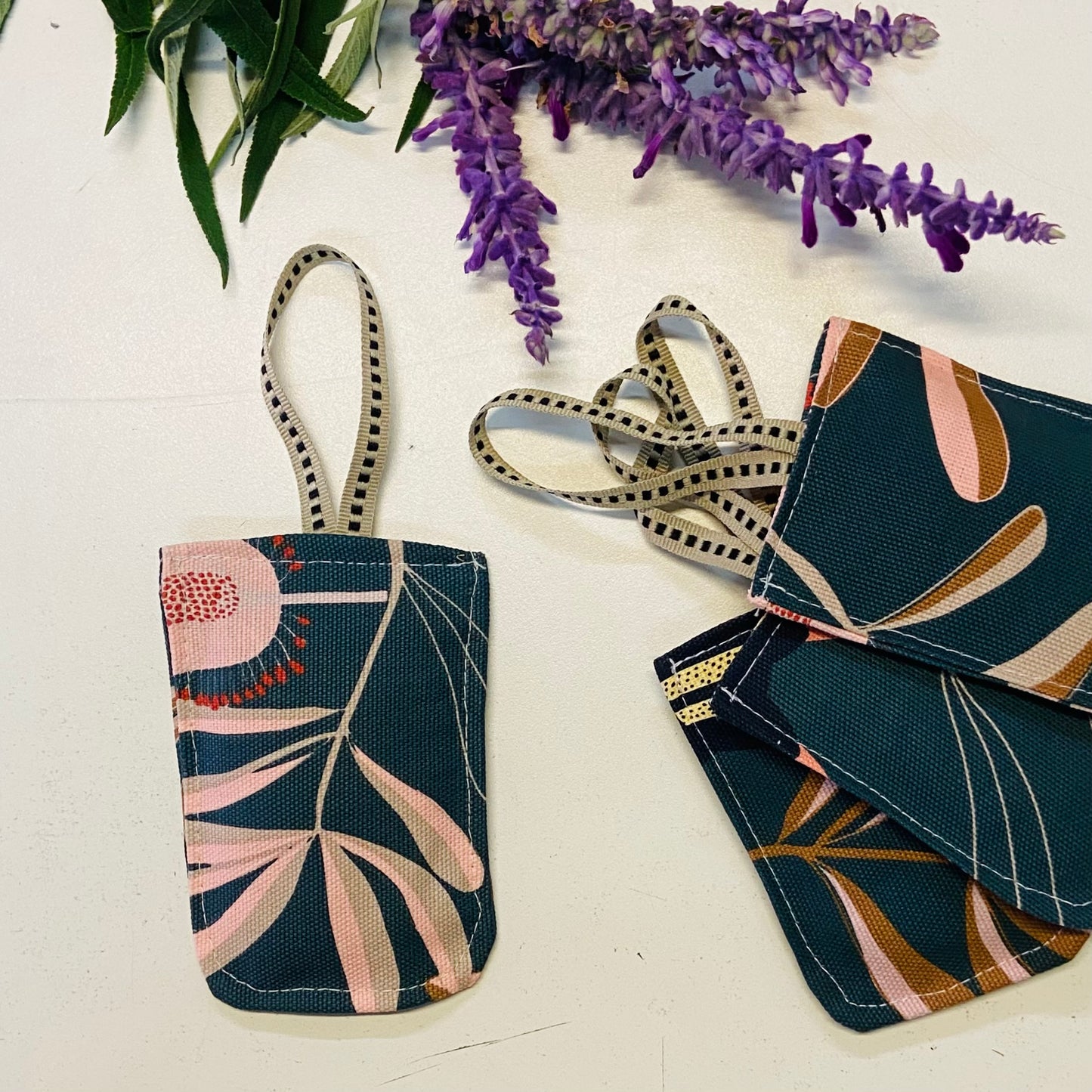 small hanging pouch filled with lavender to hang in your wardrobe or place in your clothing drawers to leave the space gmelling fresh. This set of four pouches have a botanical textile.