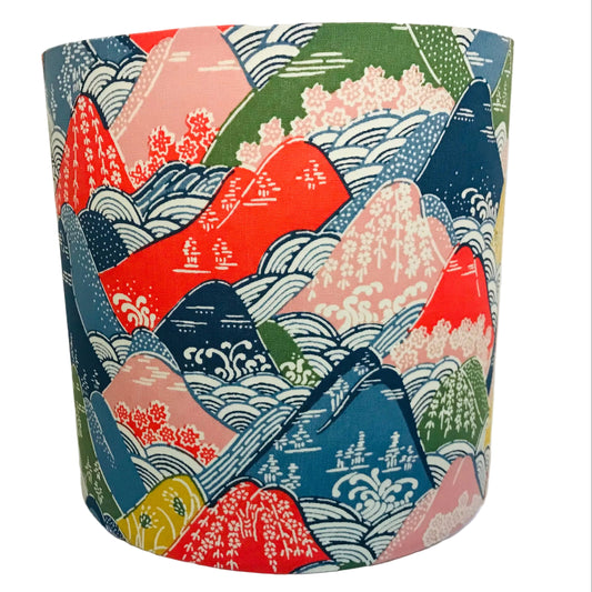 lampshade with Colorful fabric with mountain and wave pattern on a white surface