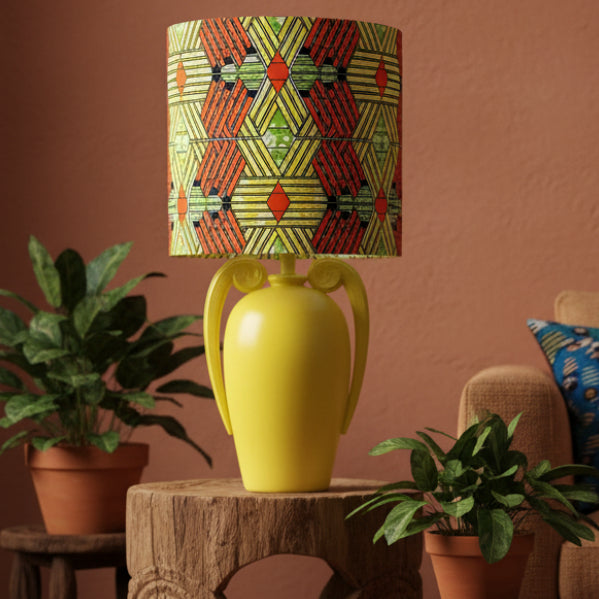 Yellow lamp with a colorful geometric patterned shade 