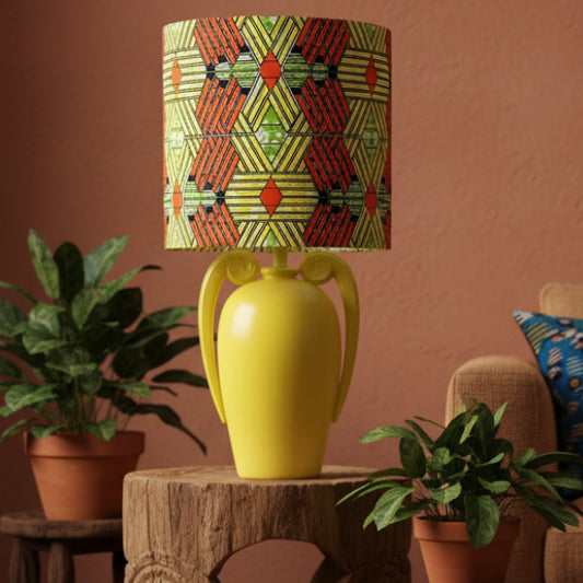 Yellow lamp with a colorful geometric patterned shade 