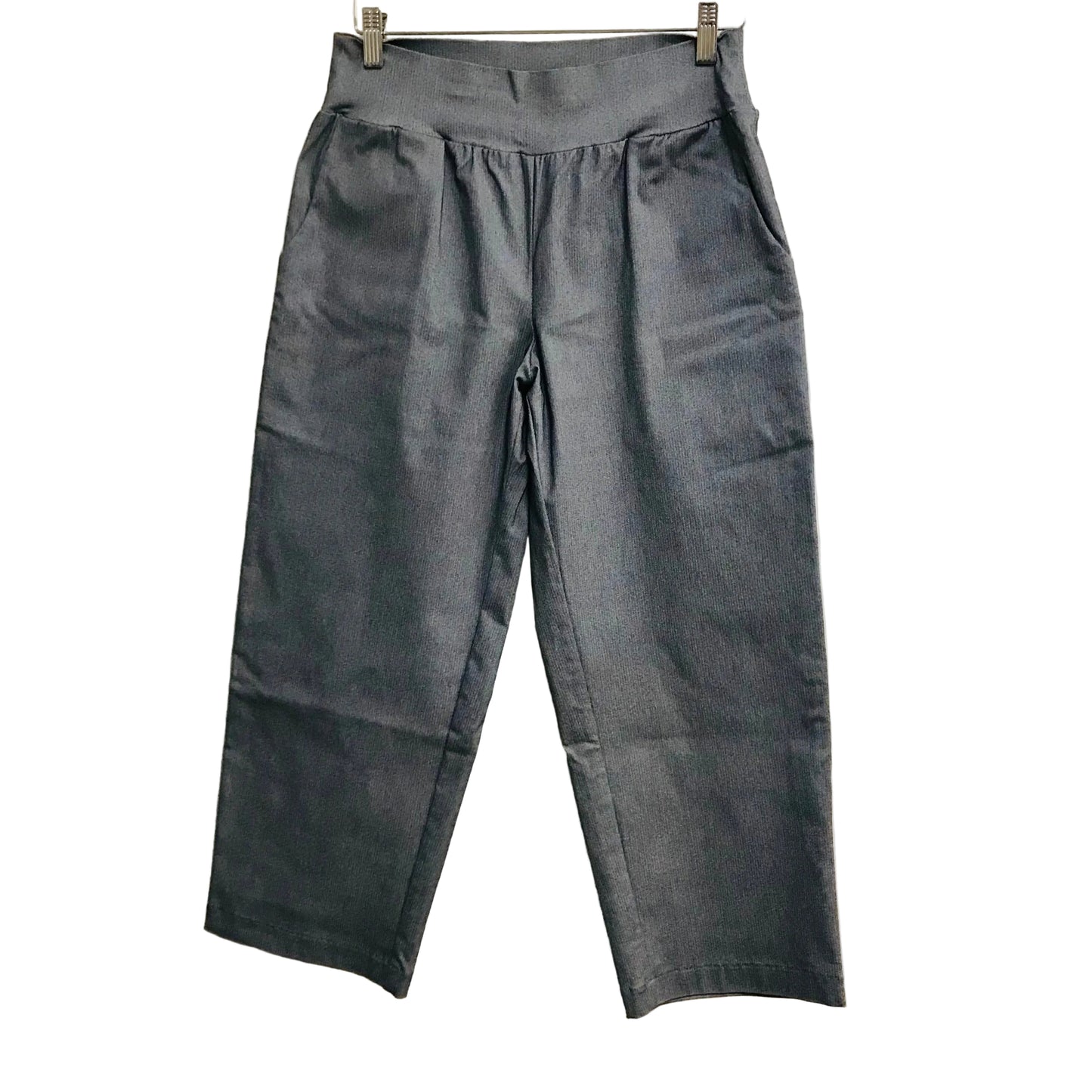 Gray pants hanging on a white background