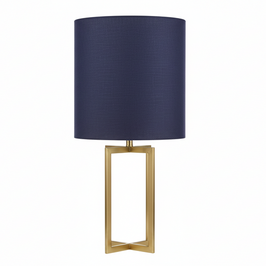 Table lamp with a navy blue shade and gold base on a white background