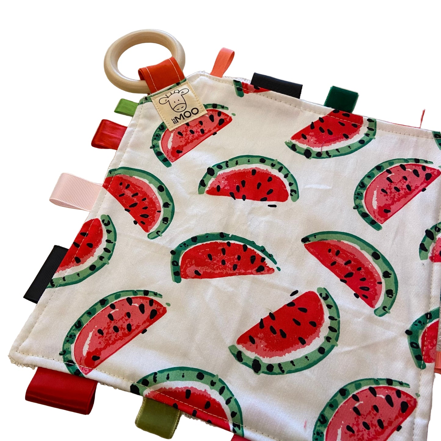 Baby teething taggie  toy with watermelon pattern on a beige background