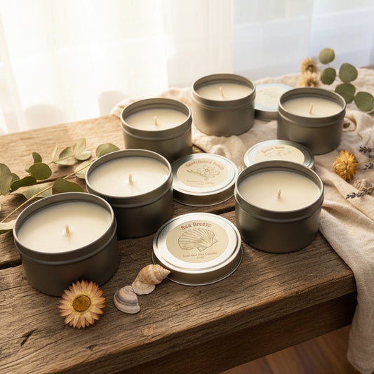 Scented soy candles in tins with labels on a wooden surface