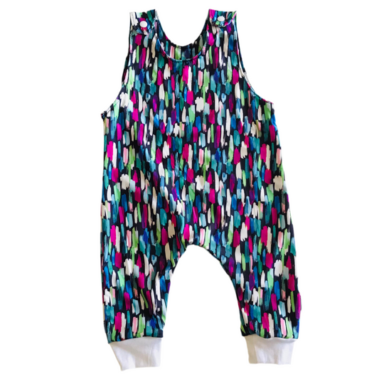 Colorful sleeveless romper with abstract pattern on a white background