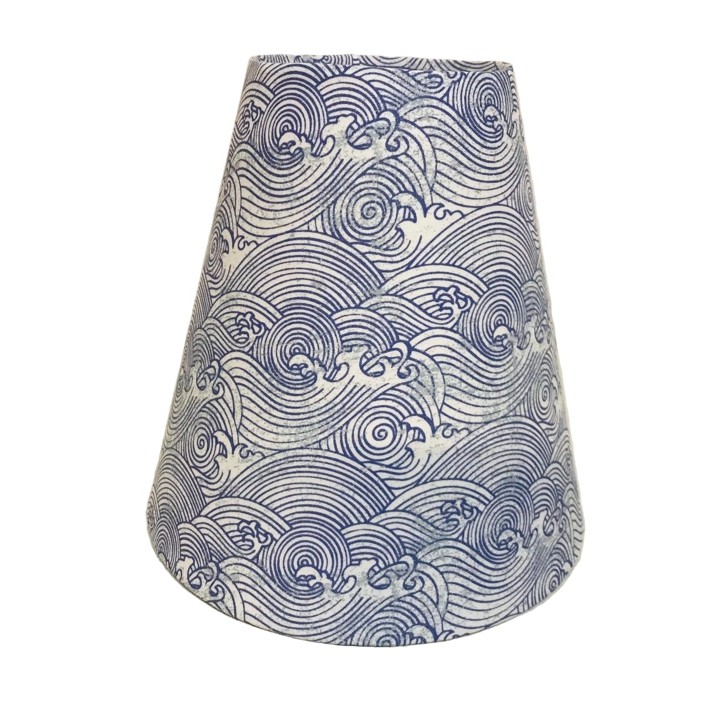 A tapered fabric lampshade featuring a blue and white wave pattern, photographed against a plain off-white background.