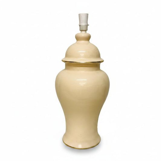 Beige ceramic lamp with a white background