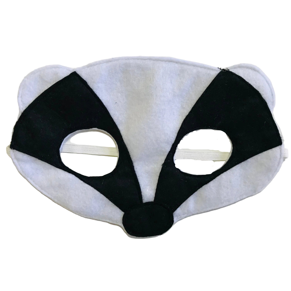 Black and white badger mask on a light beige background