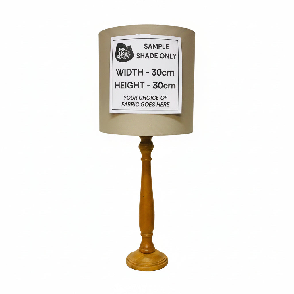 Lamp with wooden base and gray shade on a white background