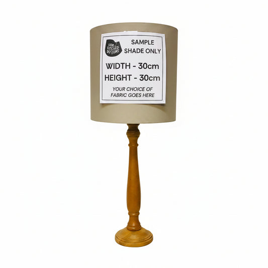 Lamp with wooden base and gray shade on a white background