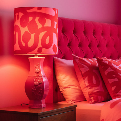 Pink lamp with a red and pink patterned shade