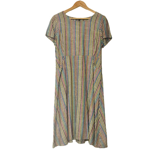 A short-sleeve A-line dress with a multicolor vertical stripe pattern hanging on a wooden hanger against a plain white wall.