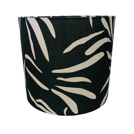 Black lampshade with white leaf pattern on a white background
