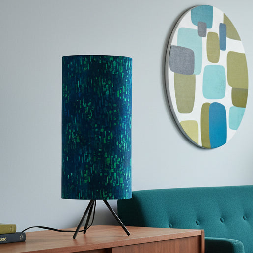 Table lamp with a blue and green patterned shade in a living room
