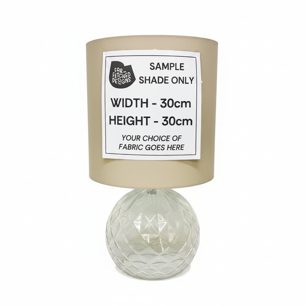 Lampshade with a label indicating sample size and fabric choice options on a white background.