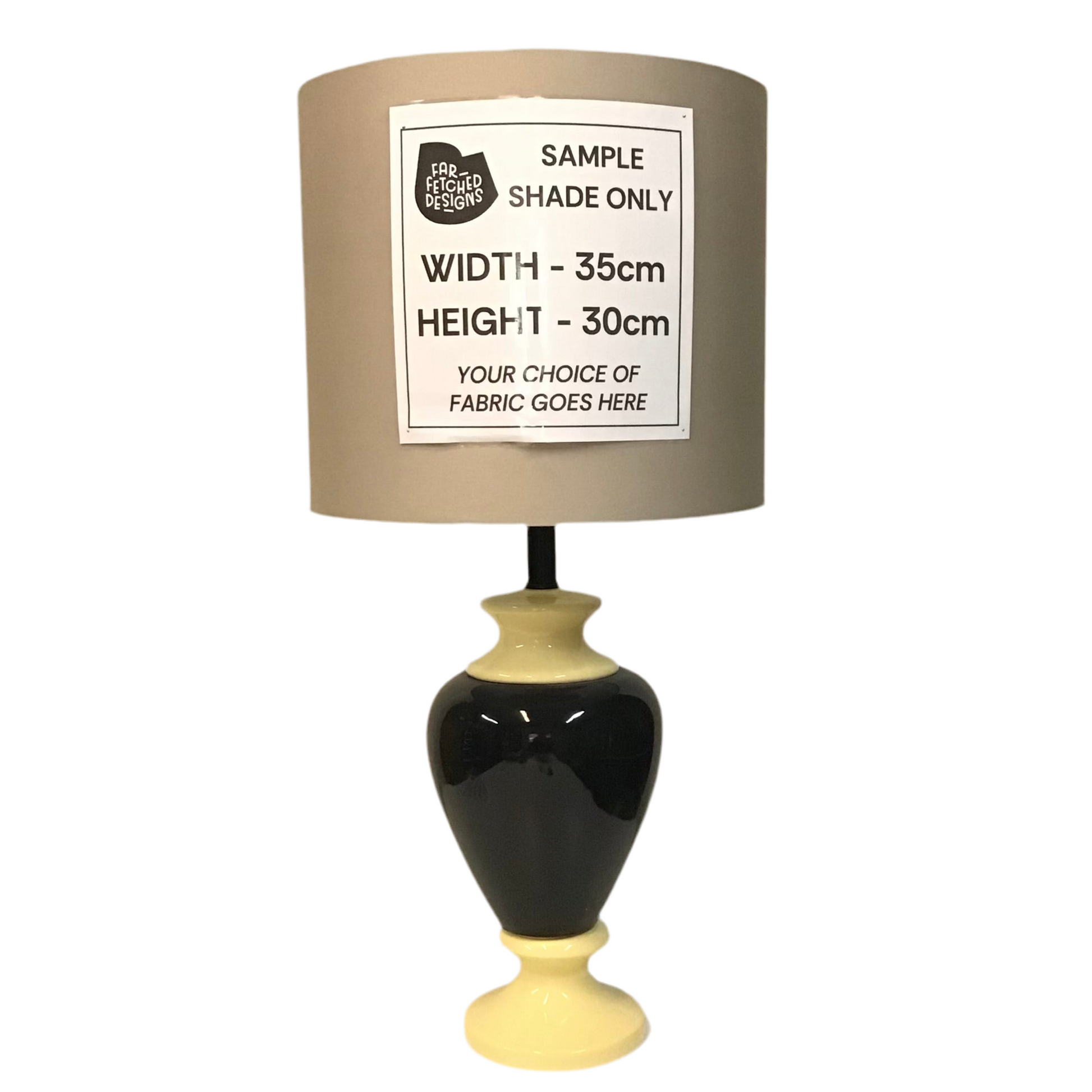 Lamp with a beige shade and black base on a white background