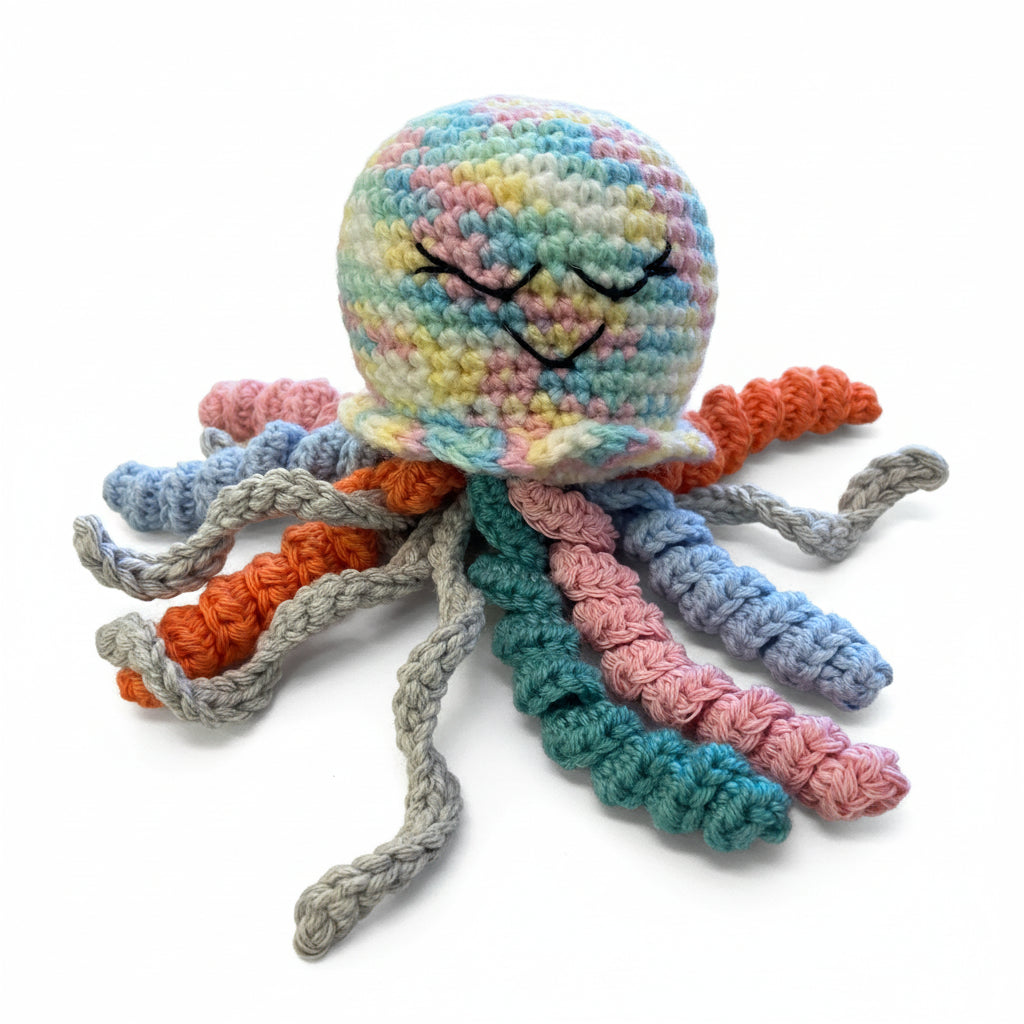 Colorful crocheted octopus toy on a wooden surface