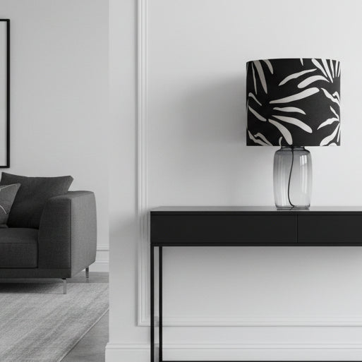Lamp with a black and white zebra pattern shade on a white background