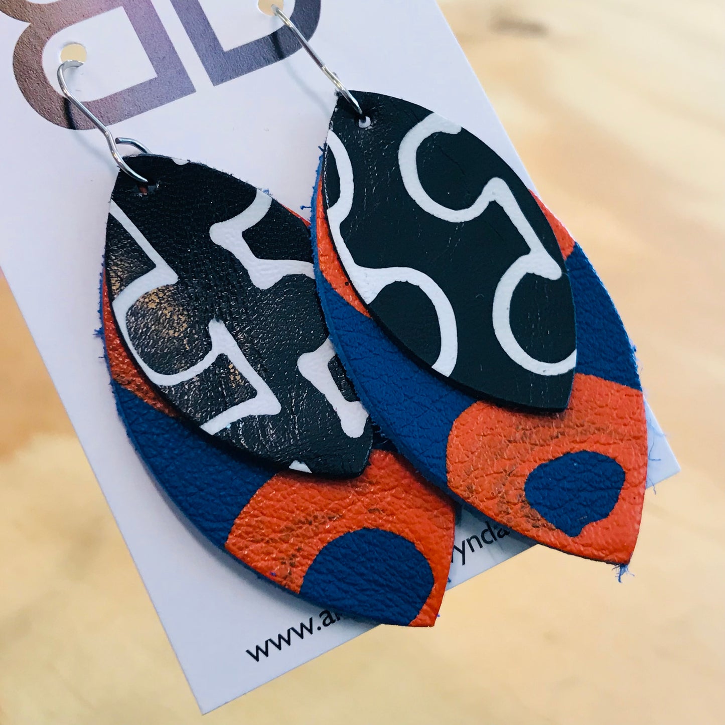 Hand painted leather earrings - The Orbi