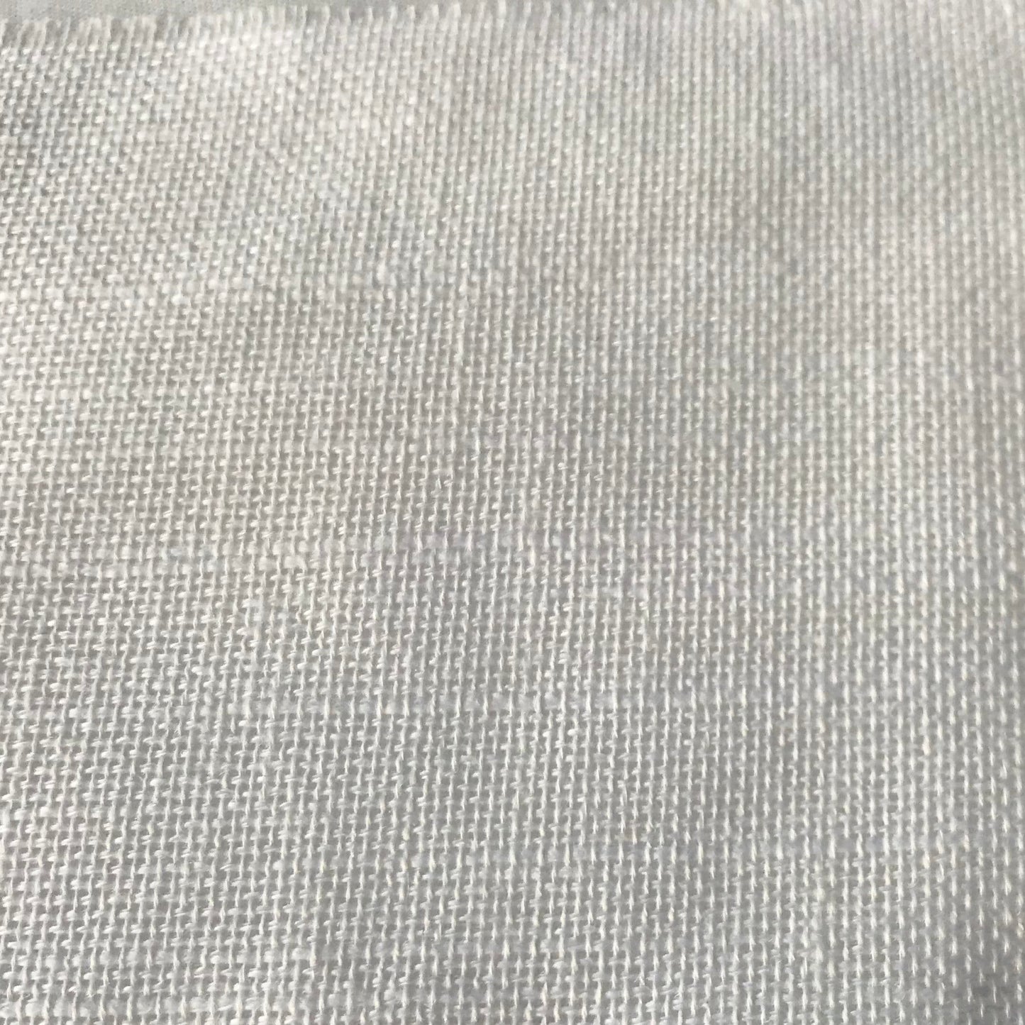 A close-up of a light gray woven fabric texture with a fine mesh-like pattern.