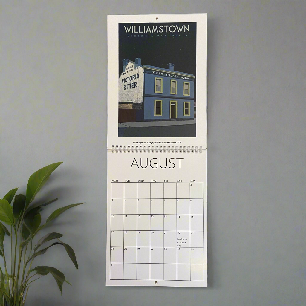 Wall calendar with August page featuring a building and sign on a gray wall.