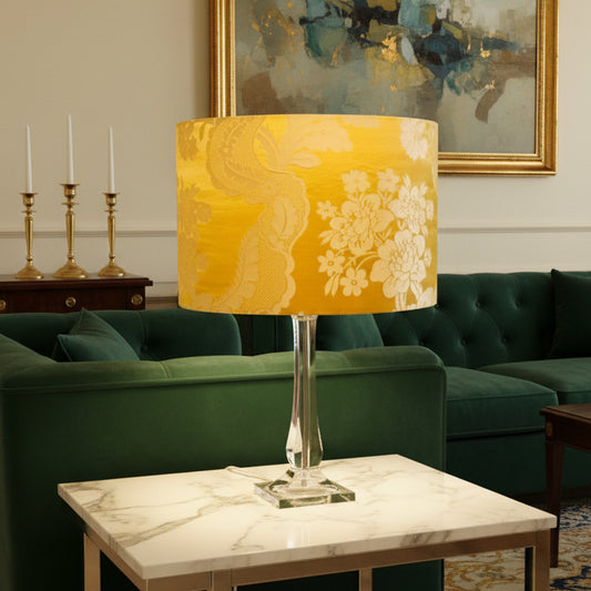 Yellow floral-patterned lampshade on a clear base