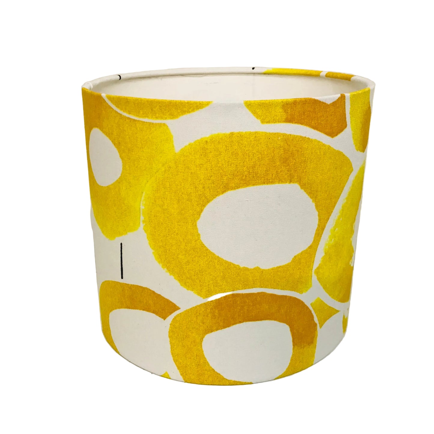 Yellow and white patterned lampshade on a light background