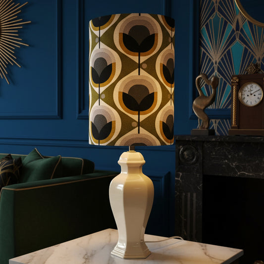 Decorative lamp with a patterned shade on a white surface.