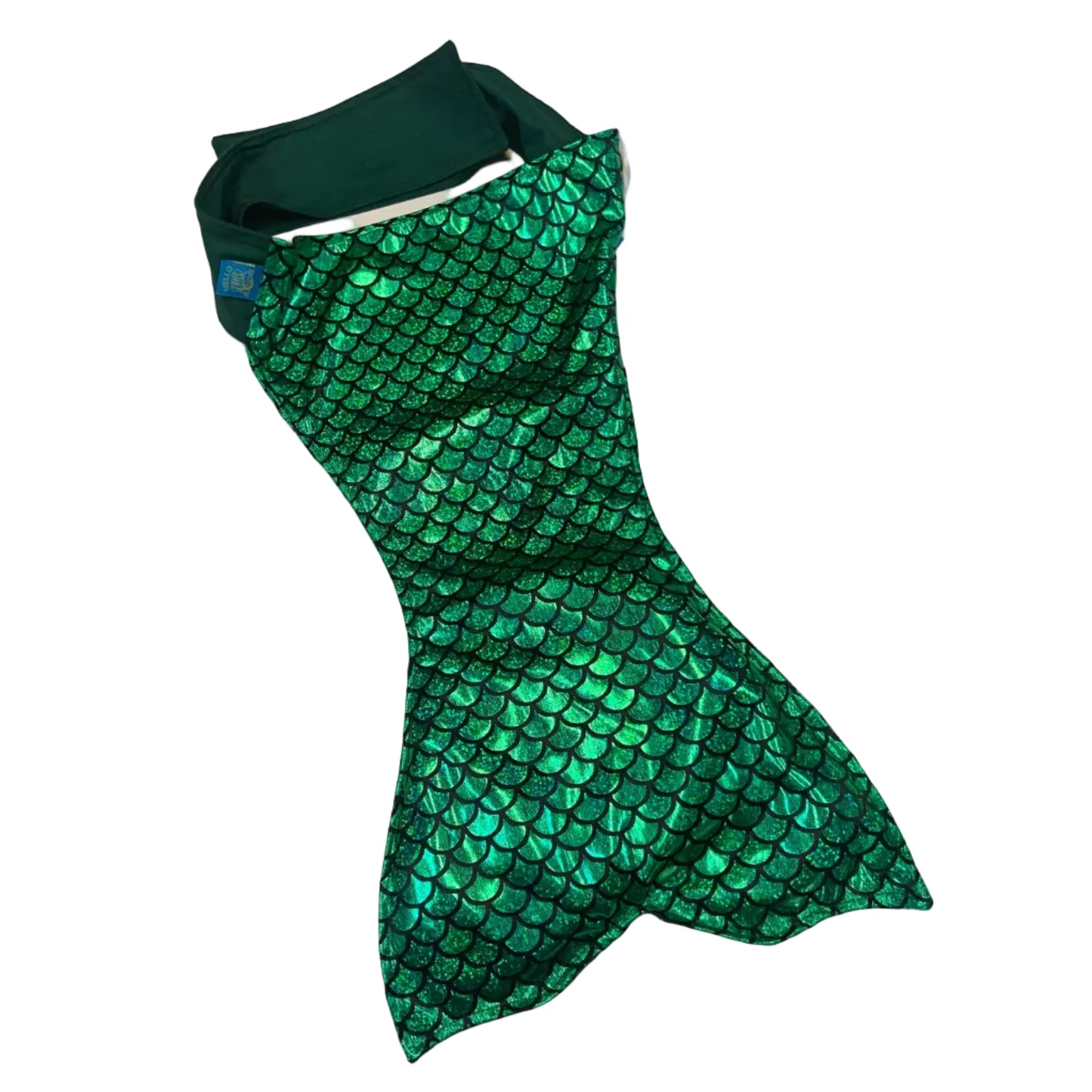 Green mermaid tail on a white table