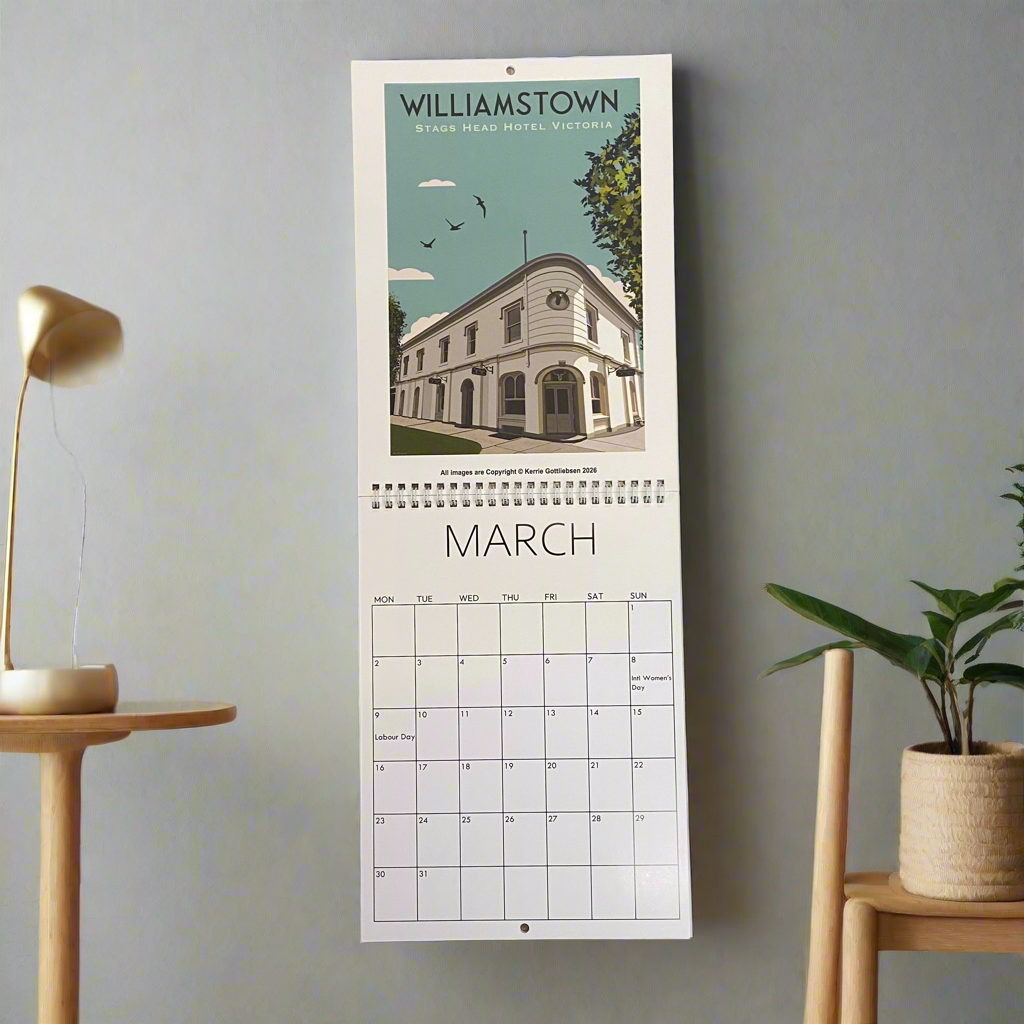 Calendar with a scenic view of a building and text on a gray wall.